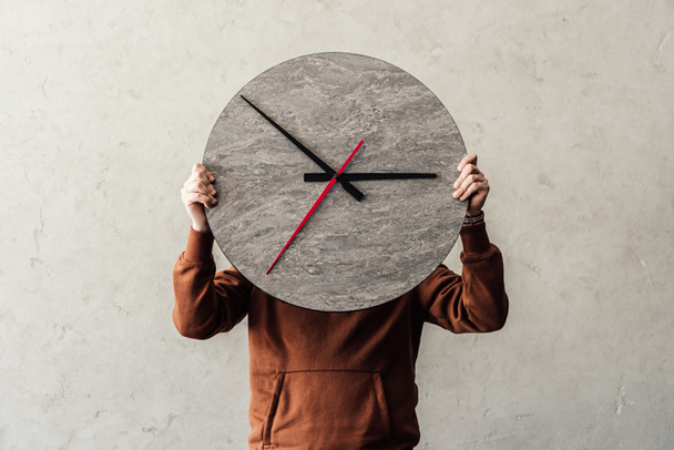 Person holding clock  - Photo, Image