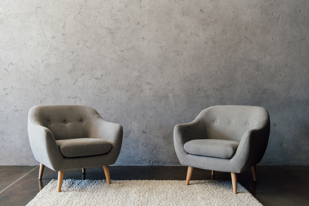 Grey armchairs on carpet  - Photo, Image