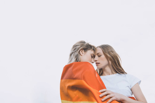 Homosexual couple with lgbt flag  - 写真・画像