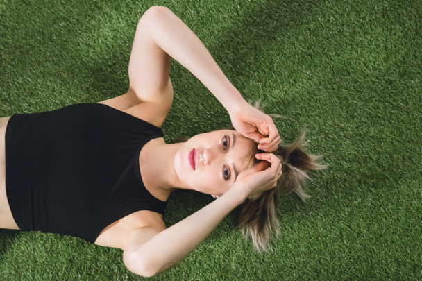 caucasian girl lying on grass - Photo, Image