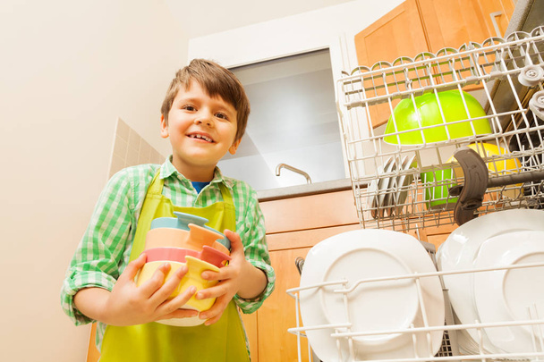 boy near dishwasher in kitchen - 写真・画像