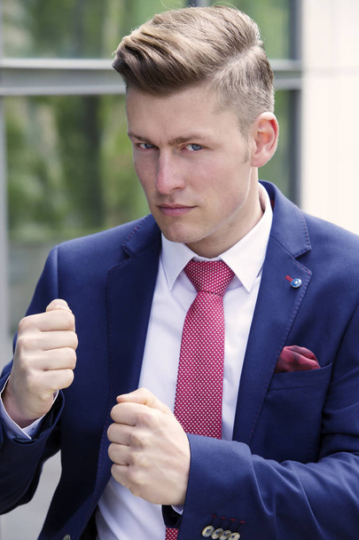 portrait of blond businessman posing as a boxer - Fotoğraf, Görsel
