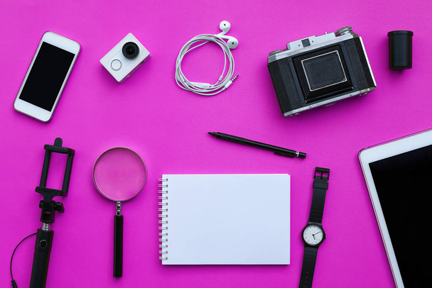 Flat lay of accessories on pink desk background - 写真・画像