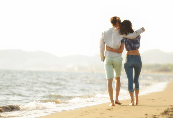 happy couple walking on the beach - Photo, image