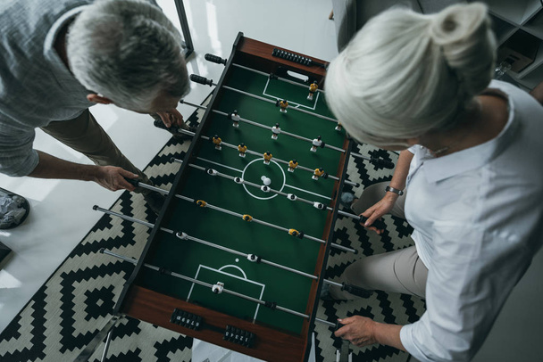 colleagues playing foosball - Photo, Image