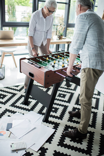 colleagues playing foosball  - Photo, Image
