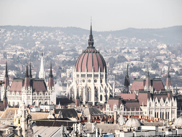 Huge dome of Hungarian Parliament Building - Orszaghaz. Unusual view from St. Stephens Basilica. Budapes, Hungary - Foto, Imagem