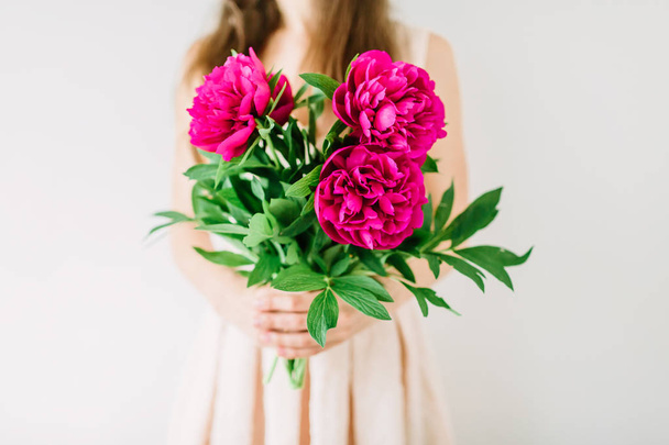 woman holding in hands peony bouquet. - Photo, Image