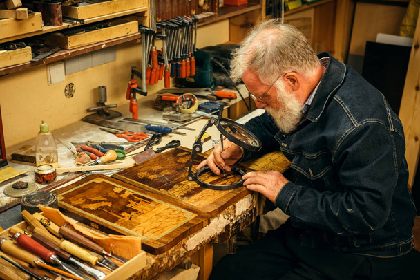 Senior wood carving professional during work - Foto, Imagem
