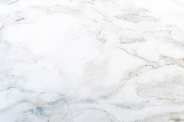 Witte marmeren textuur is een witte basis met subtiele grijze aders - Foto, afbeelding