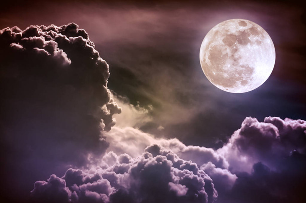 Nighttime sky with clouds and bright full moon with shiny.  - Photo, Image