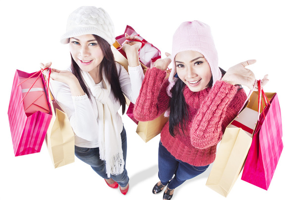 Happy holiday shopping in winter with friends-isolated - Foto, Imagen