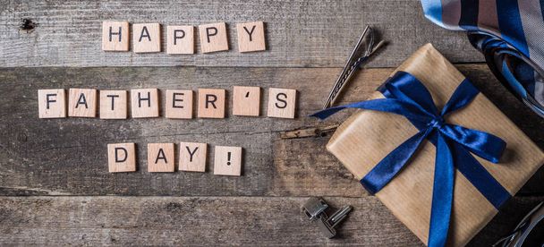 Fathers day concept - present, tie on rustic wood background - Fotoğraf, Görsel