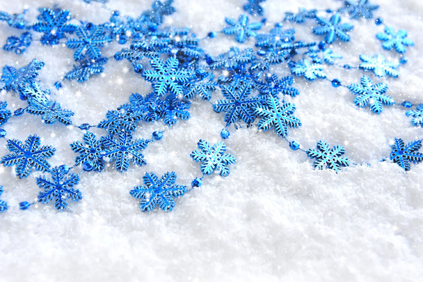 Christmas blue snowflakes of decoration on snow - Fotografie, Obrázek