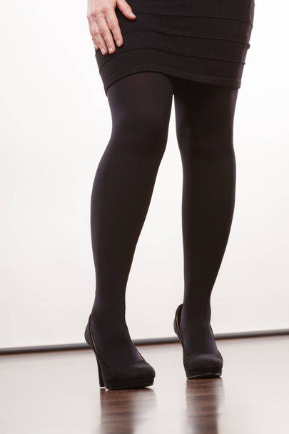 Female legs in black pantyhose heeled shoes - Photo, Image