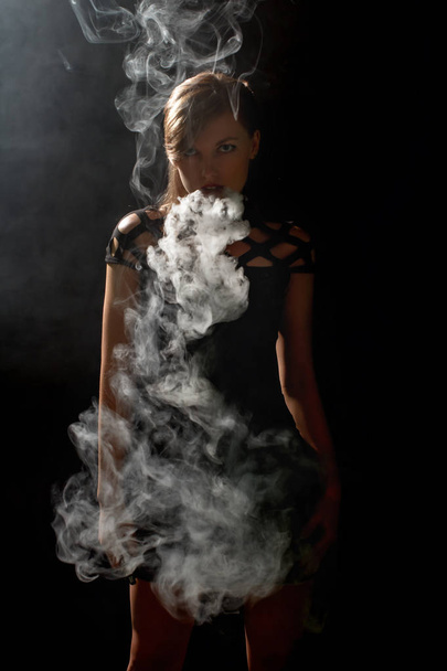 Beautiful girl vaping from e-cigarett - Fotoğraf, Görsel