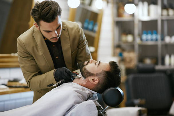 Handsome barber doing job  - Photo, image