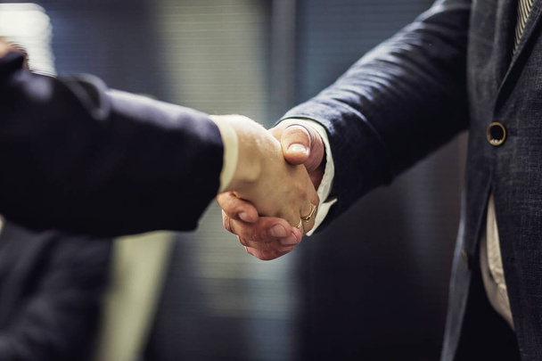 Business people shaking hands, finishing up a meeting,Business People Shaking Hands Agreement Concept,Business handshake,handshake in office,Close up of handshake - Фото, зображення