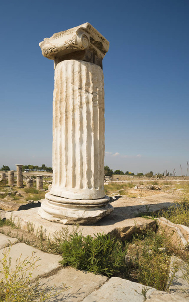Hierapolis City Ruins. The ruins of the ancient city of Hierapolis is located adjacent to the hot springs of Pamukkale in Turkey. The site is a UNESCO world heritage site. - Photo, image
