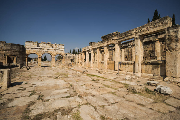 Hierapolis City Ruins. The ruins of the ancient city of Hierapolis is located adjacent to the hot springs of Pamukkale in Turkey. The site is a UNESCO world heritage site. - Photo, image