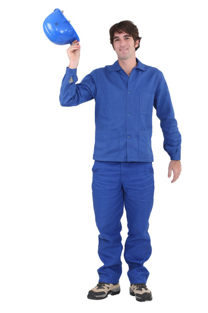 Portrait of worker in jumpsuit taking his hard hat off - Fotoğraf, Görsel