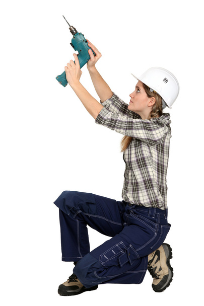 A female handyman with a drill. - Foto, Imagem