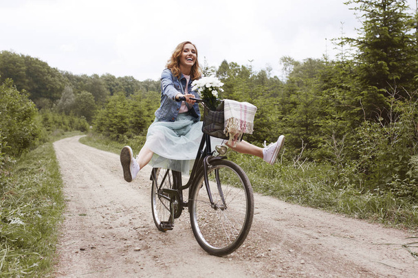 woman riding a bike  - Photo, Image