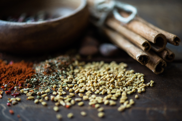 scattered sesame seeds and herbs with cinnamon - Photo, Image