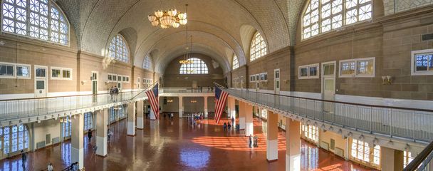 NEW YORK CITY - OCTOBER 2015: Tourists visit Ellis Island museum - Fotó, kép