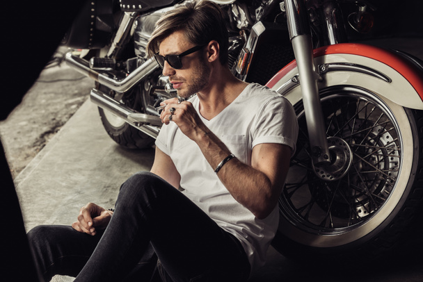 Stylish man with motorbike  - Фото, зображення
