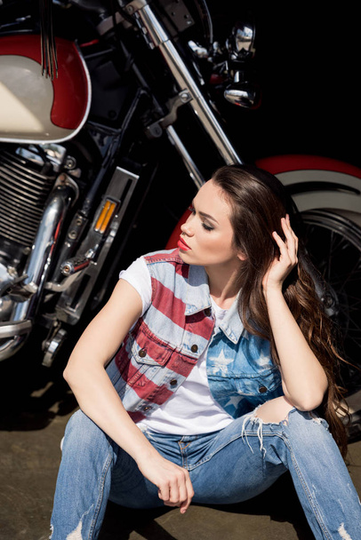 Young woman with motorbike  - Фото, изображение