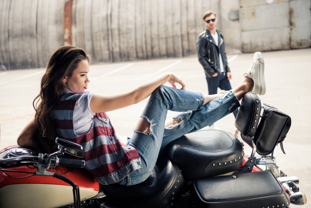 Young couple with motorcycle  - Photo, Image