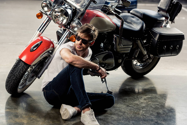 Stylish man with motorbike  - Photo, Image
