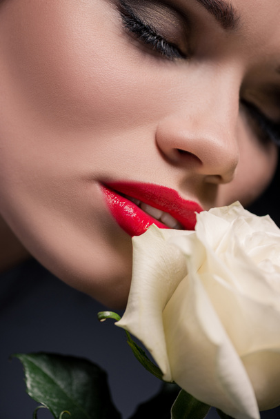 lady smelling rose with eyes closed - Foto, Imagem