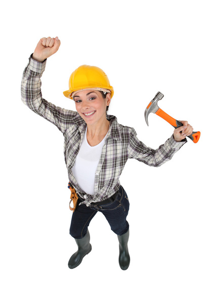 Mason jubilant women with hammer in hand - Foto, Imagen