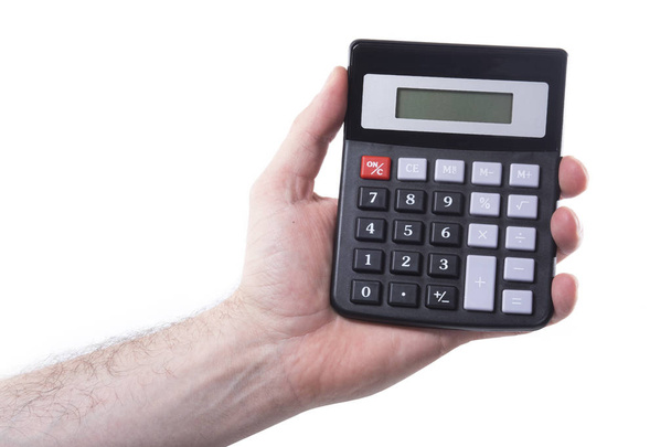 Hombre sosteniendo una calculadora en su mano
 - Foto, Imagen