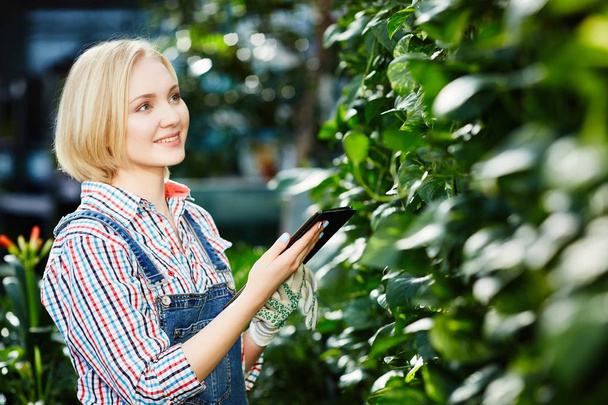 Pretty girl with plants  - Photo, image