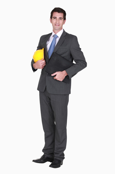 Smart businessman holding folder - Foto, Imagen