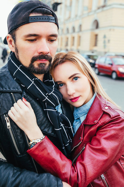 Stylish couple in city . Beautiful couple in love hugging and kissing on street - Zdjęcie, obraz