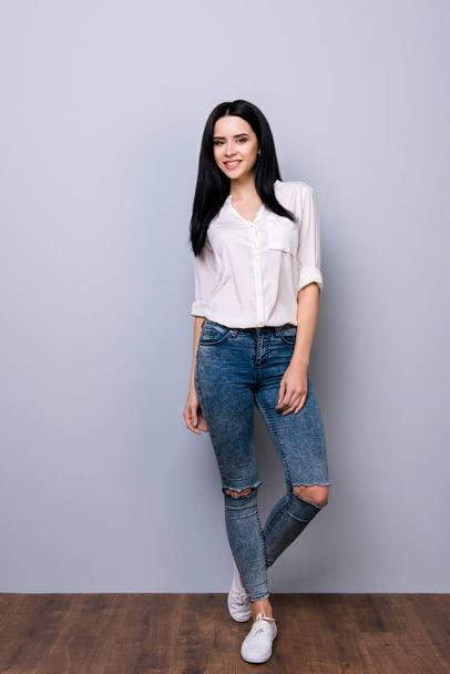 PLayful brunette gorgeous girl in casual outfit is standing with - 写真・画像