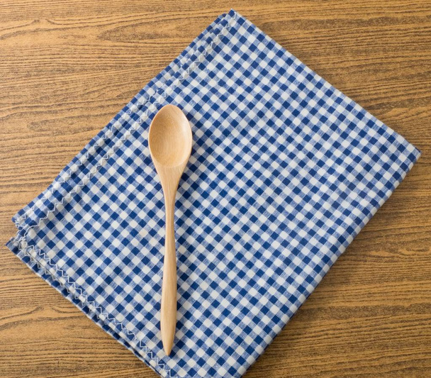 Wooden Spoon on A Blue Checked Towel - Photo, Image
