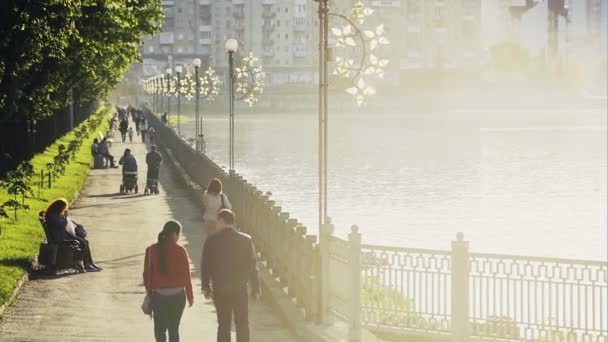 People walking on waterfront - Felvétel, videó