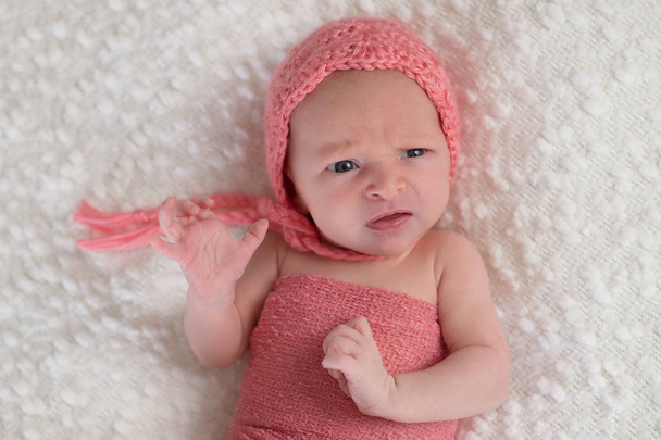 Newborn Baby Girl with Funny Expression - Photo, Image