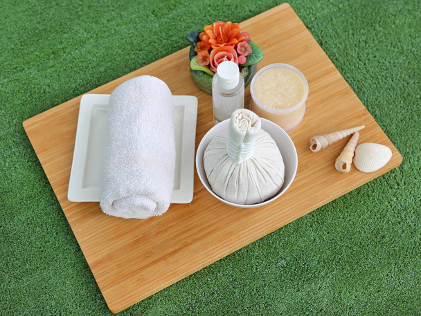 Spa herbal compressing ball with towels and Salt Scrub, Spa concept background - Фото, зображення