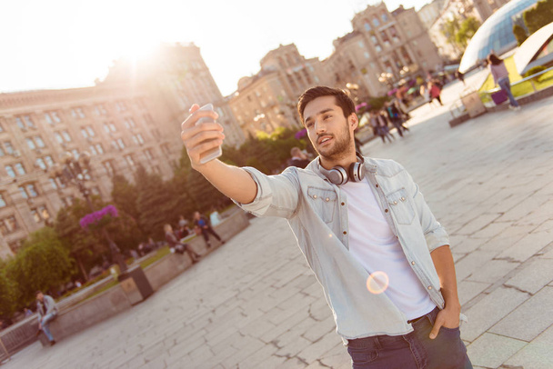 Selfie time! Young funky blogger is making photo for his social  - Foto, imagen