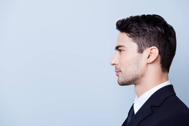 Side profile photo of a young handsome brunete realtor with bris - Foto, afbeelding