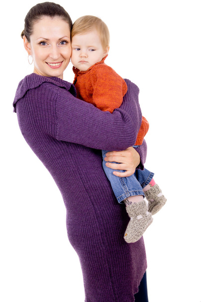 Mother tenderly holding the baby in her arms - Photo, Image