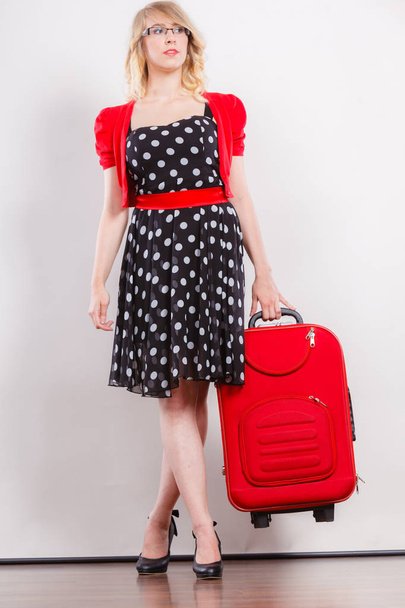 Elegant fashion woman with red suitcase - Zdjęcie, obraz