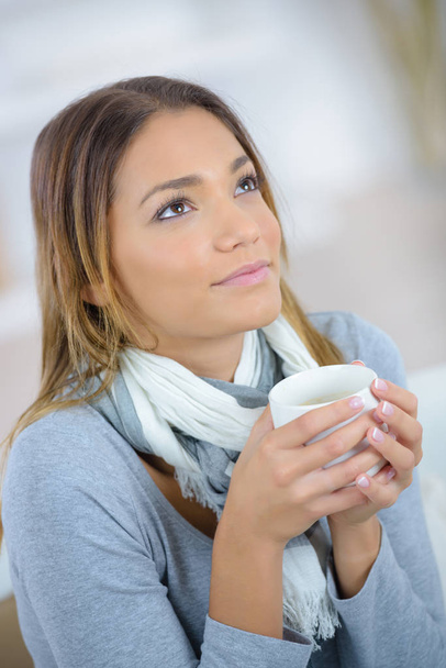 happy young woman with cup of tea at home - Photo, image