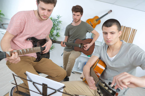 teen music band performing on a stage - Foto, Imagem